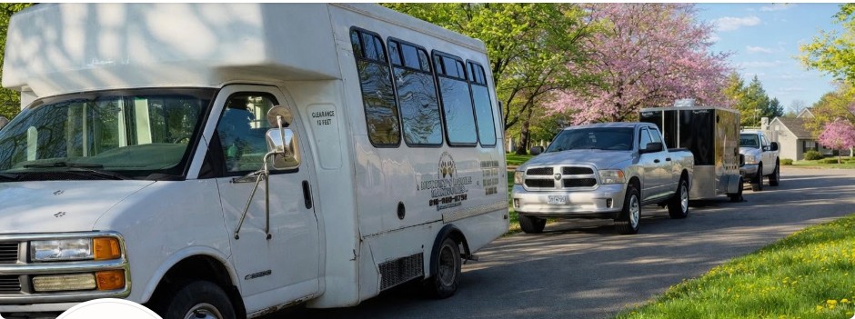 Murphy's Mobile Manicures & Grooming's van, truck and grooming trailer parked on a residential street